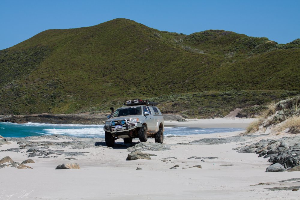 Hilux On Rock, Peaceful Bay Gap beach. Western Australia.