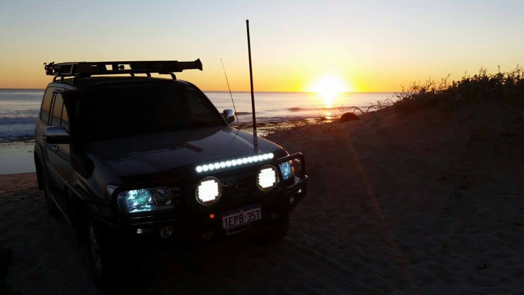 Toyota Land Cruiser 100 Series in the sunset.