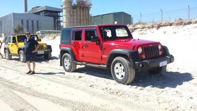 Red Jeep Wrangler Unlimited.