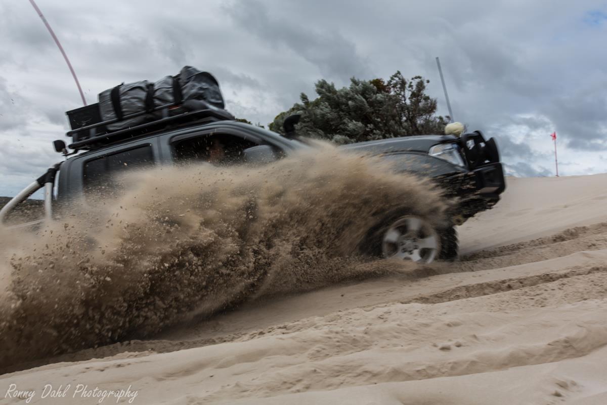 A Nissan Navara doing sand spray at Cervantes sand dunes.
