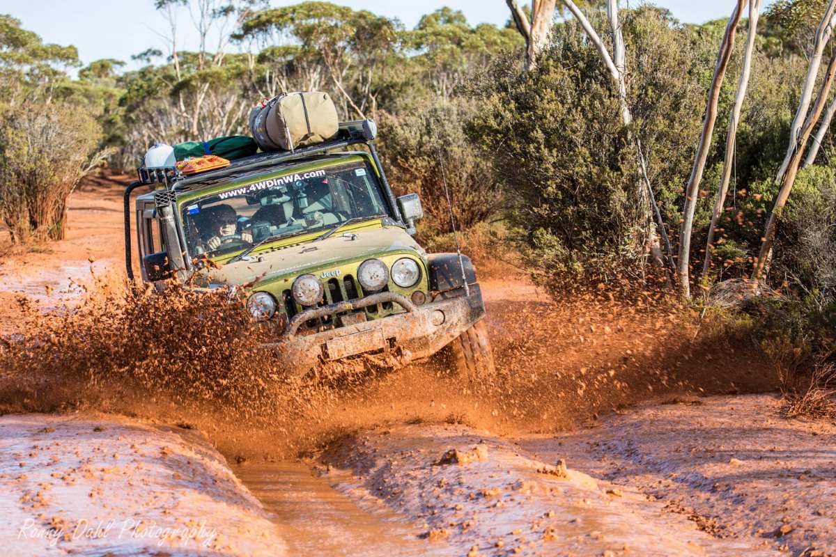 Jeep Wrangler in mud on Holland Track, Western Australia.